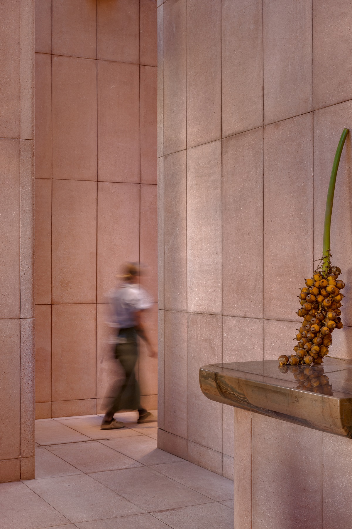 blurred figure walking into double volume restaurant entrance at rubra