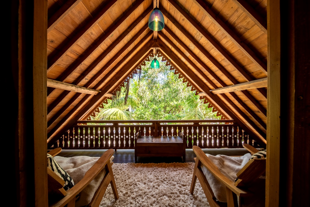 pitched bamboo ceiling open with view to treetops