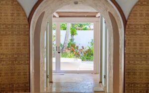 doors and arches leading from bedroom to outdoor bathroom at Sirru Fen Fushi