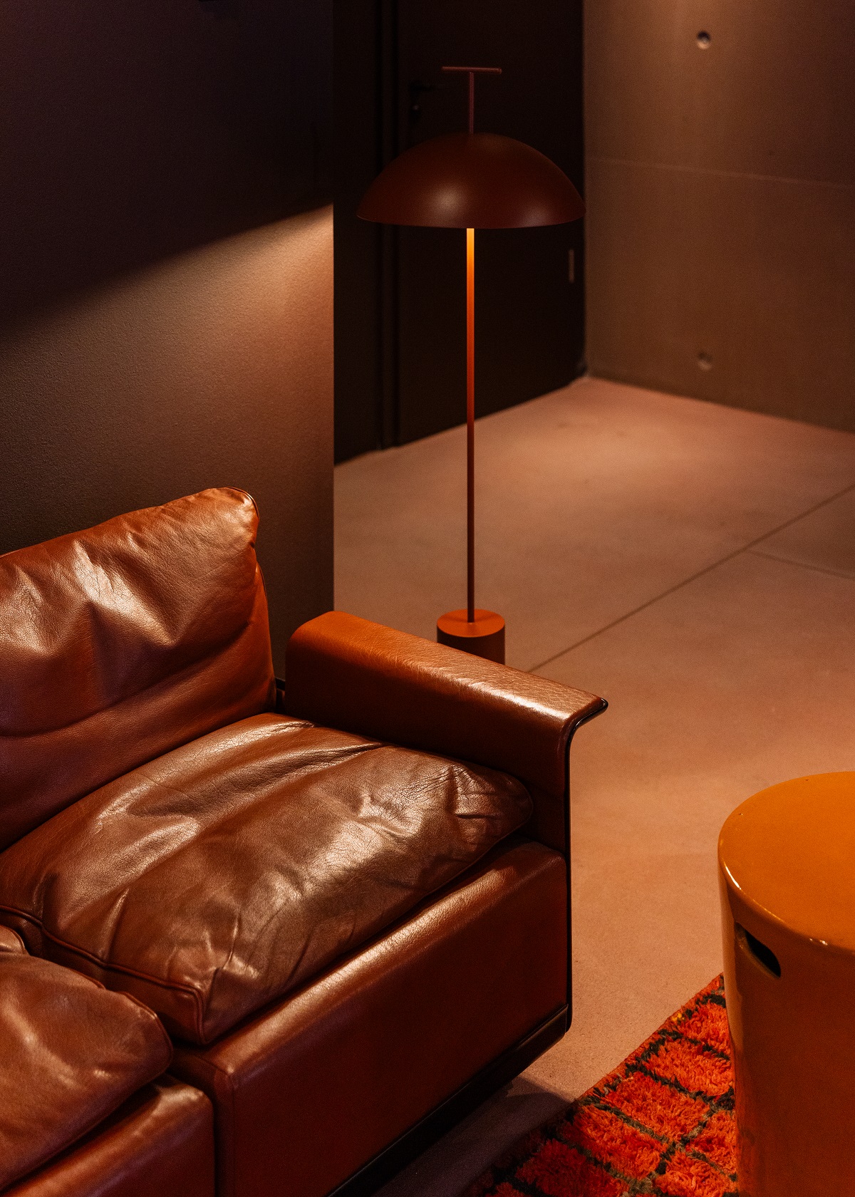 brown leather mid-century chair hotel Bosari