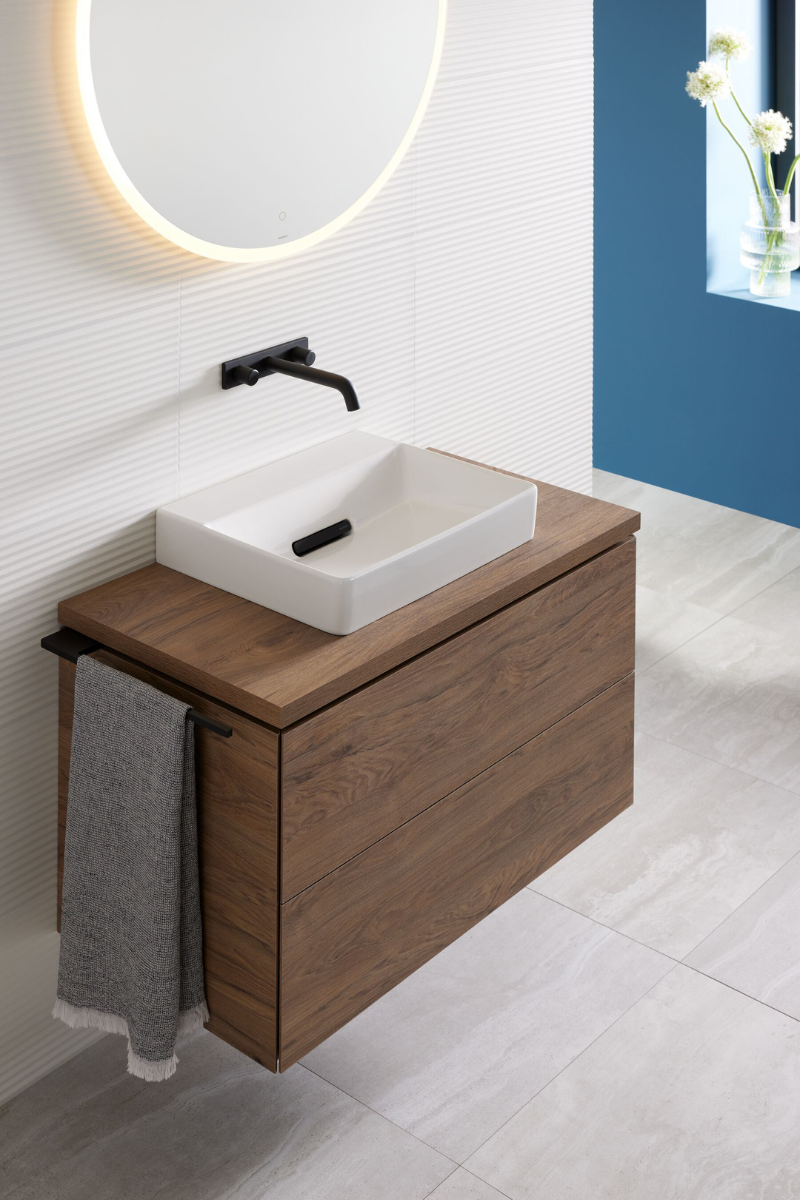 Sinks set on floating drawers oin blue bathroom