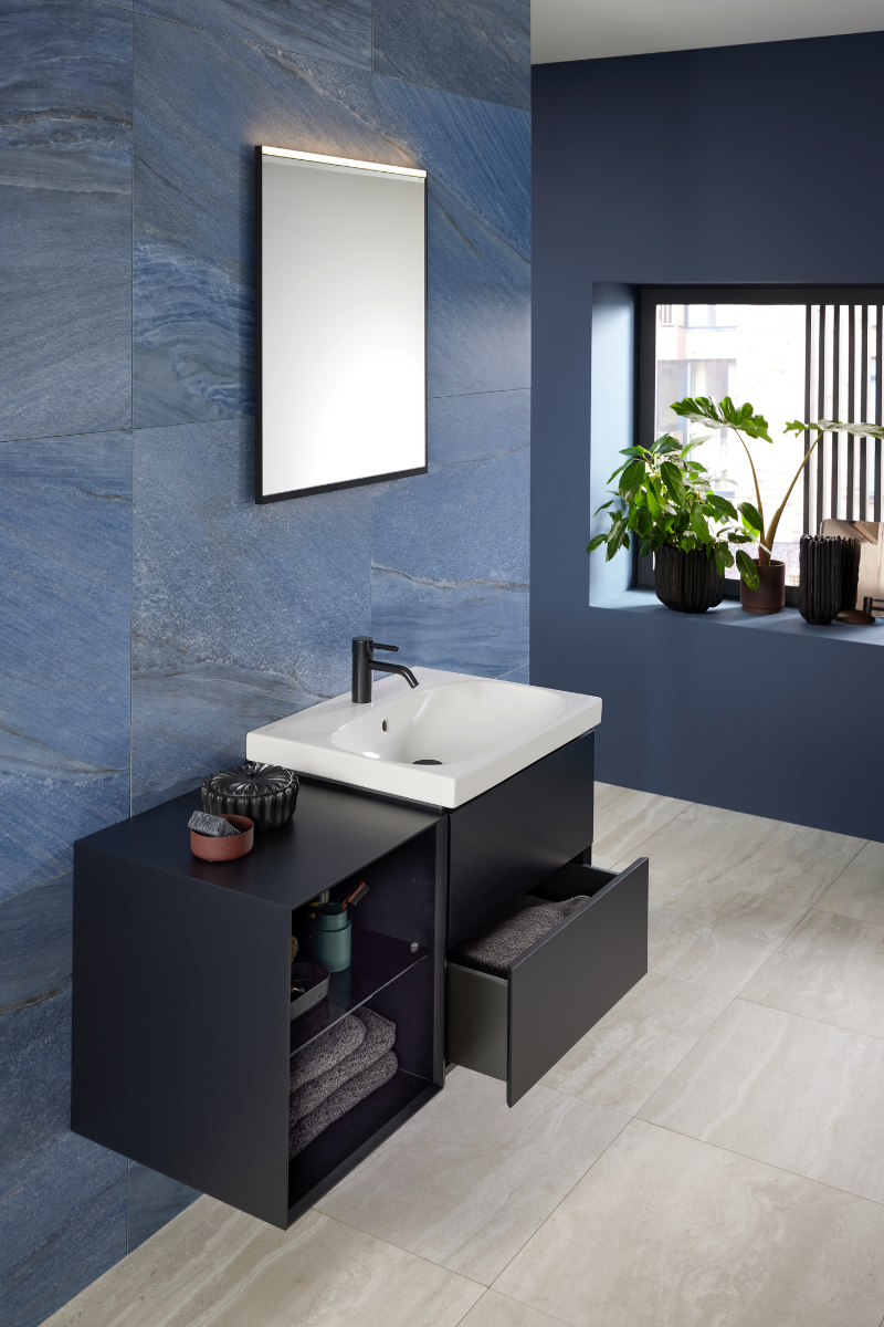 Blue walled bathroom wiht black bathroom furniture