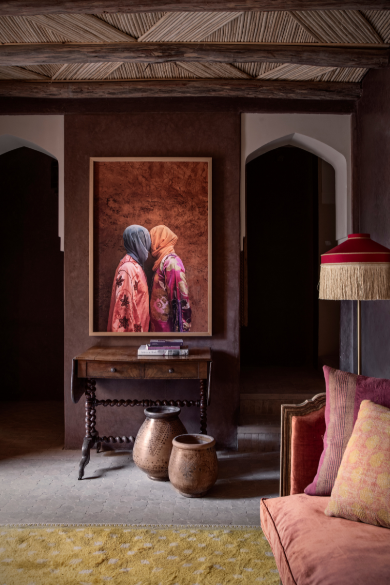 Lounge area at the Jnane Rumi, Marrakech with framed artwork of two veiled figures kissing central stage