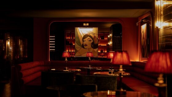 dark red interior, low lighting and vintage pin ups in Hush