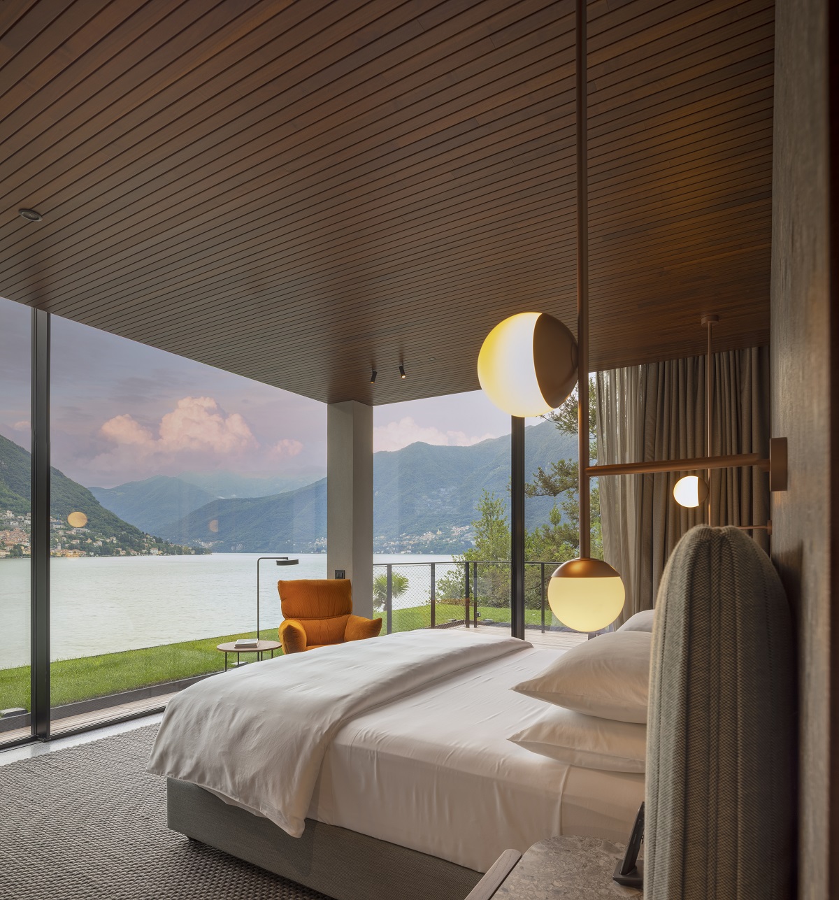 ceiling lights next to double bed with view out to lake como