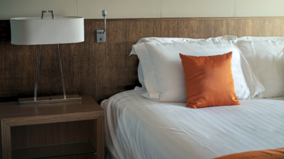 Close up shot of bed and sidetable with headboard decorate in walnut architectural film