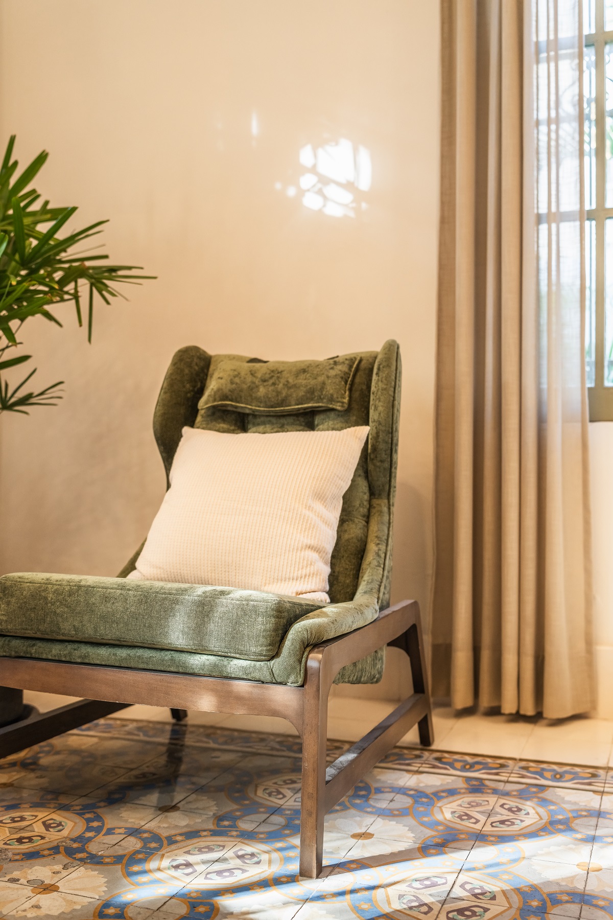 chair with plant on tiled floor