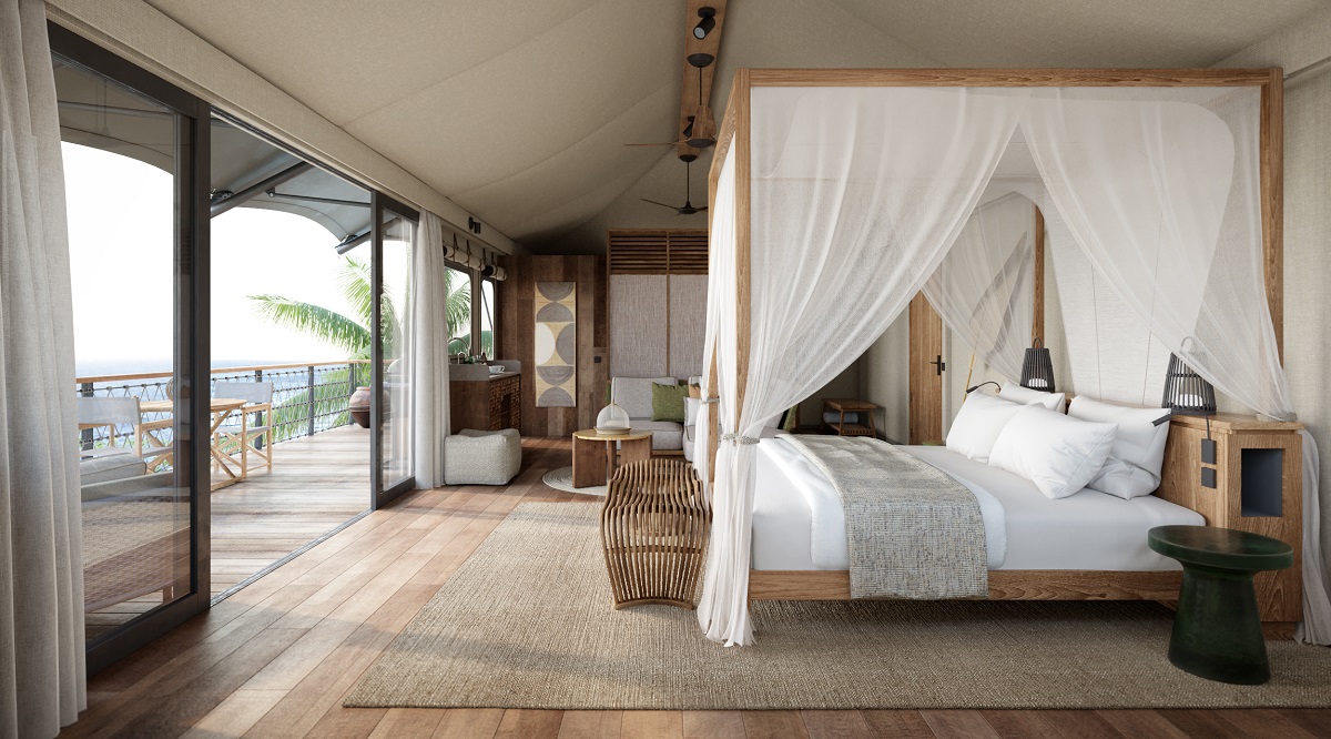 four poster bed with fabric drapes and wooden surfaces in Thailand