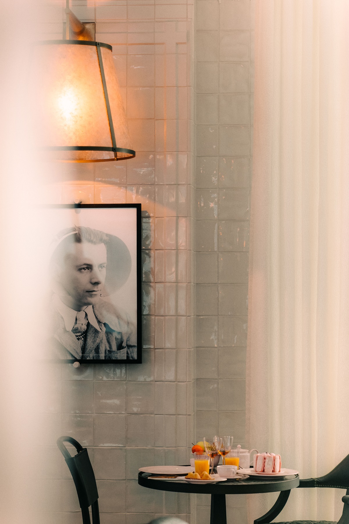 portrait and lighting on tiled wall in Maison Heler
