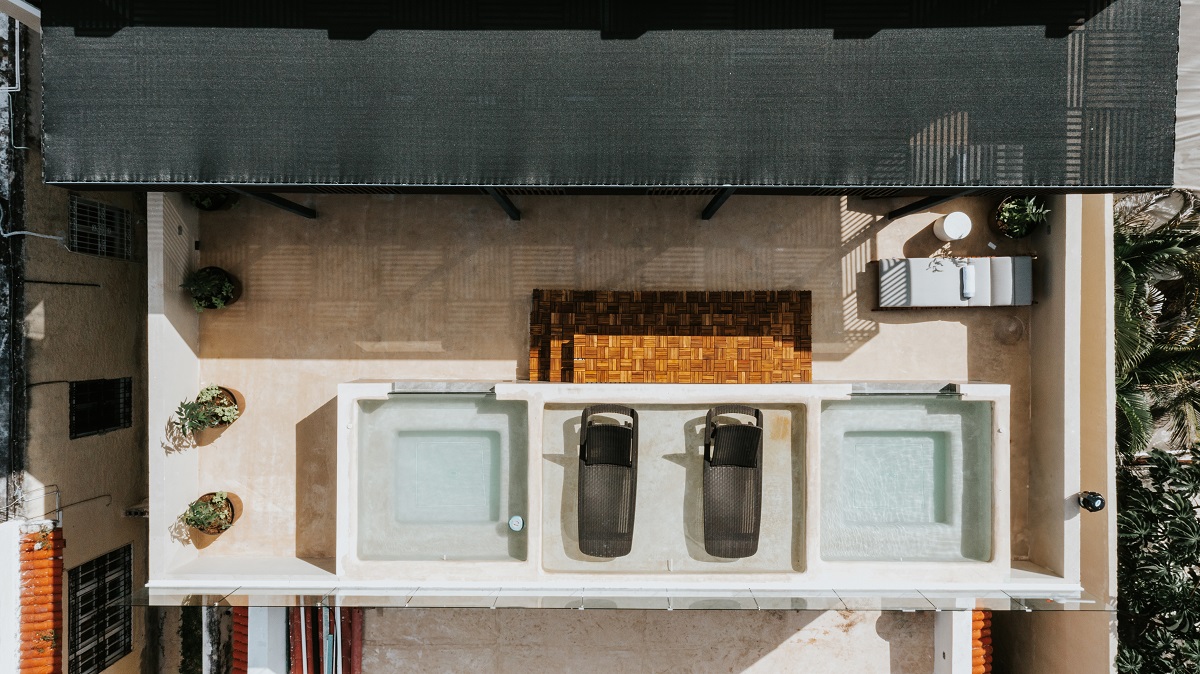 drone image of rooftop with pools at Kahal
