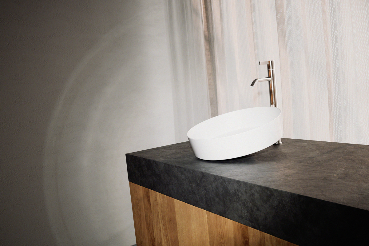 Tendo washbasin from Alape, in white on black marble worktop with wooden cupboards below.