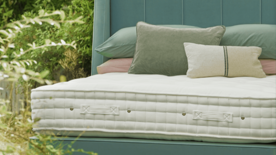 Close up shot of Hypnos Wild Cornwall bed, part of the Eden Project collaboration. Surrounded by wildflower greenery