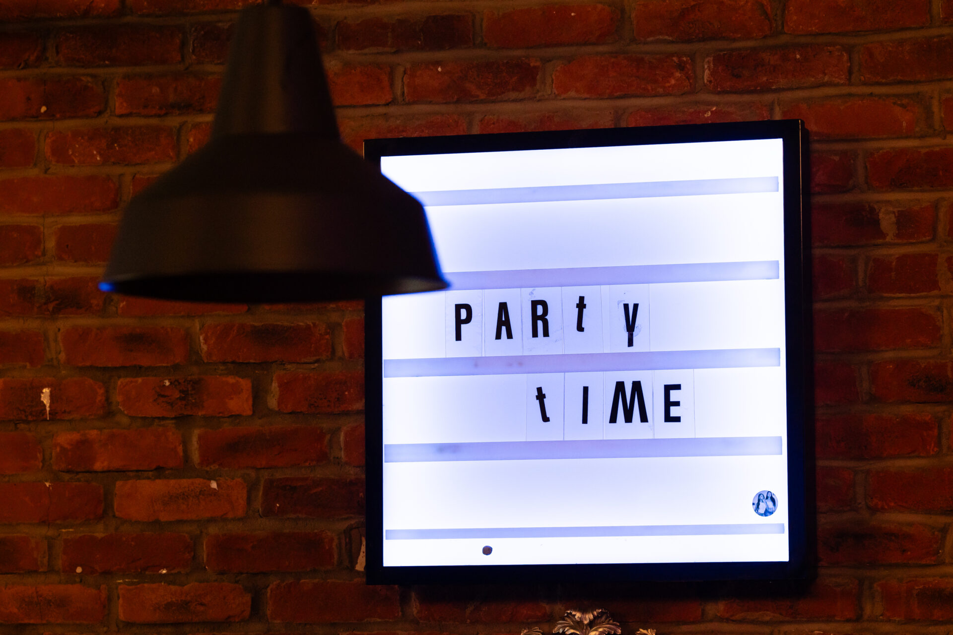 Light box with Party time in newspaper cut out font