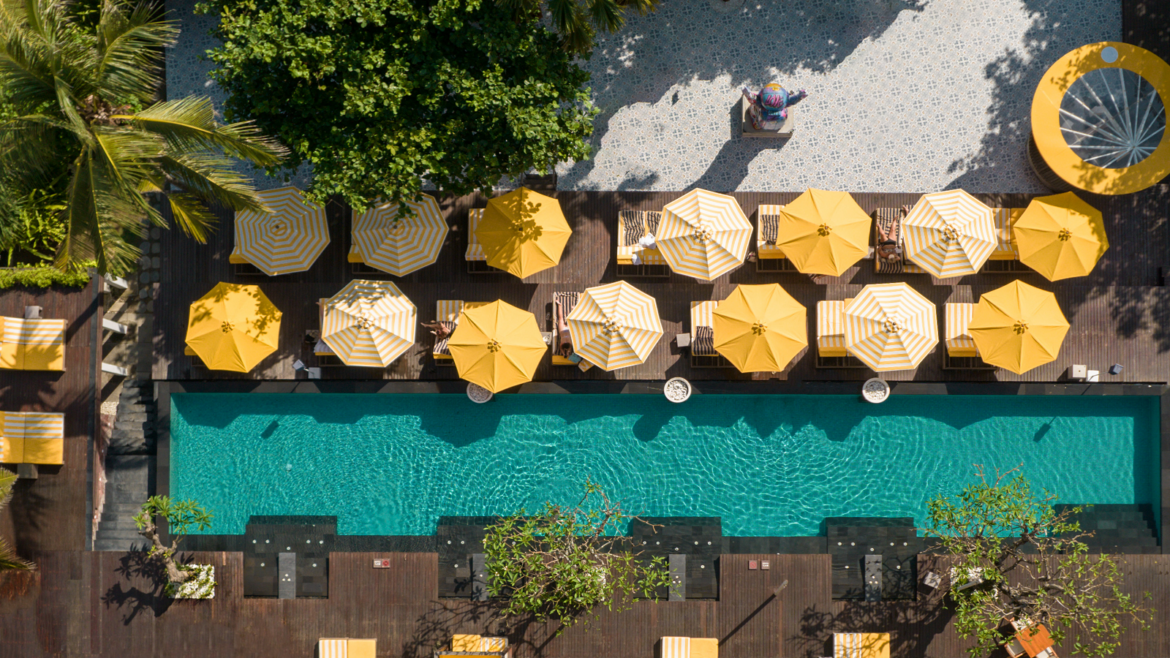 aerial view of yellow umbrellas around pool Hyde Bali