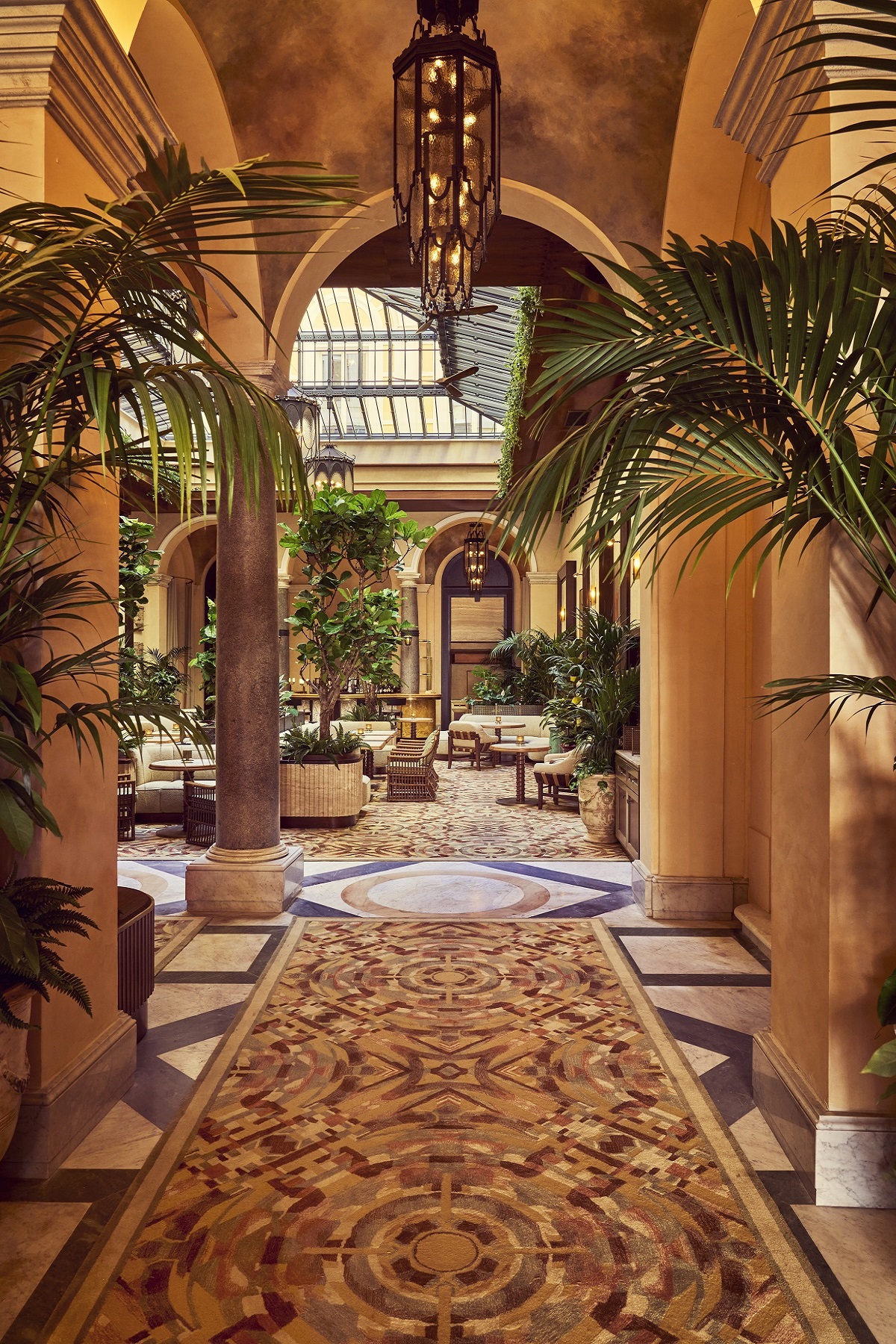 palm trees and pillars line the hotel entrance