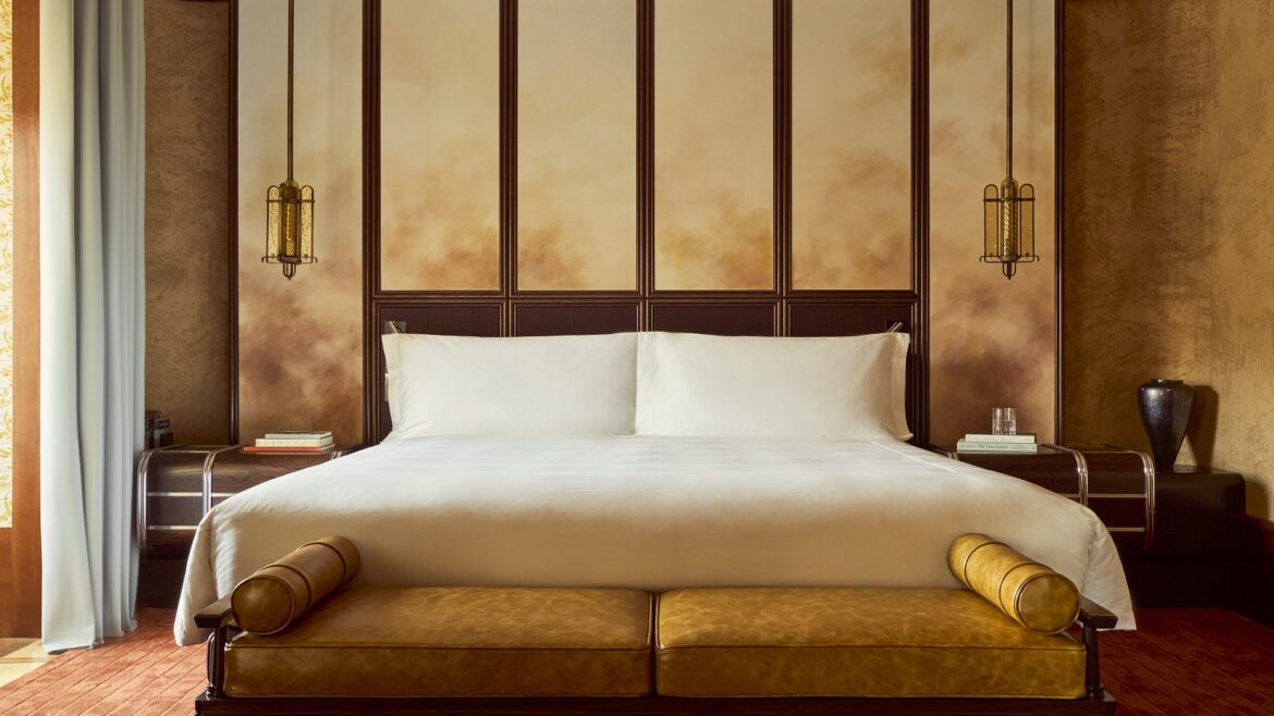 bed and panelled walls in orient Express La Minerva