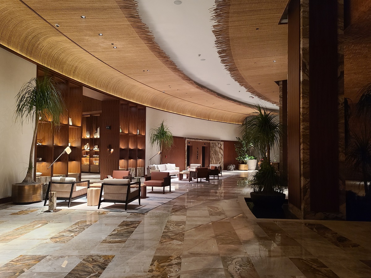 sweeping curve on the ceiling leading into St Regis Cap Cana lobby designed by Chapi Designs