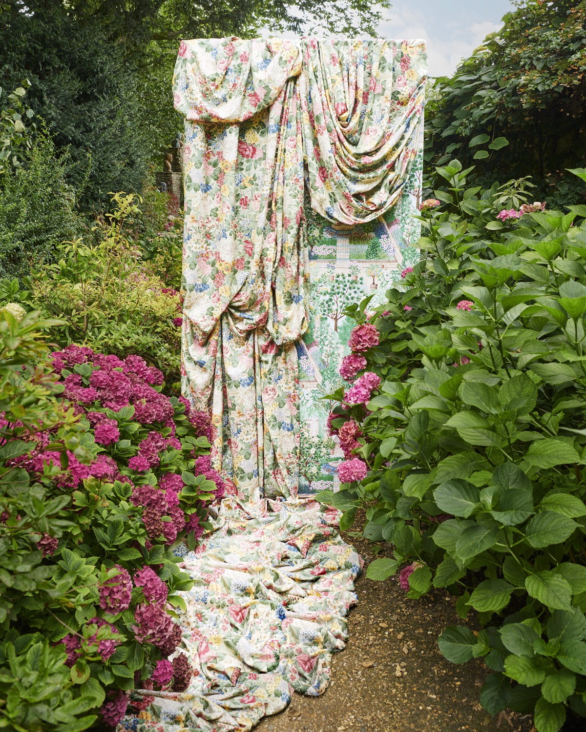 fabric draped amongst hydrangeas