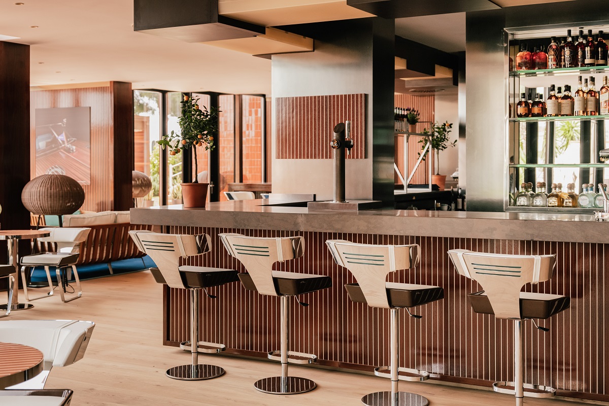 interior of Riva Lounge with wooden bar and chrome chairs