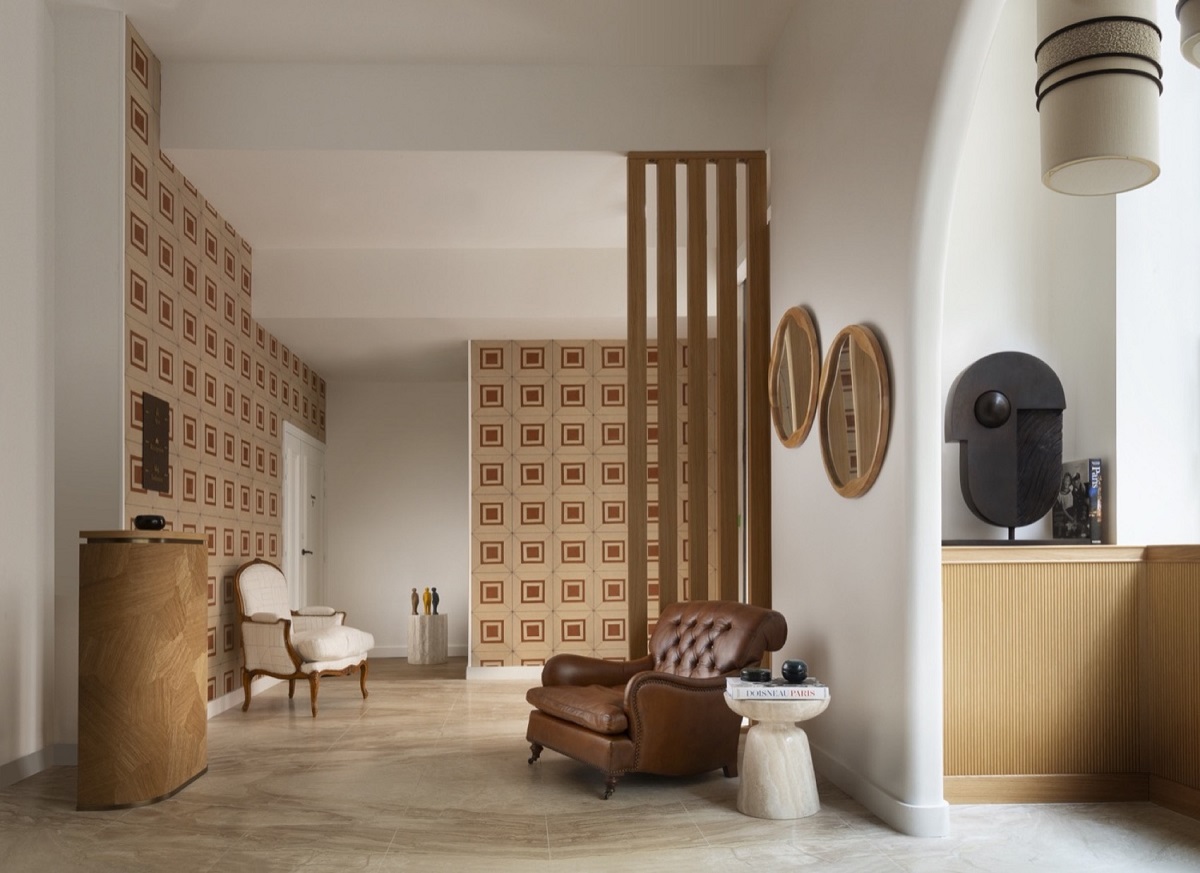 curated lobby in Hotel Drouot with chair and reception desk