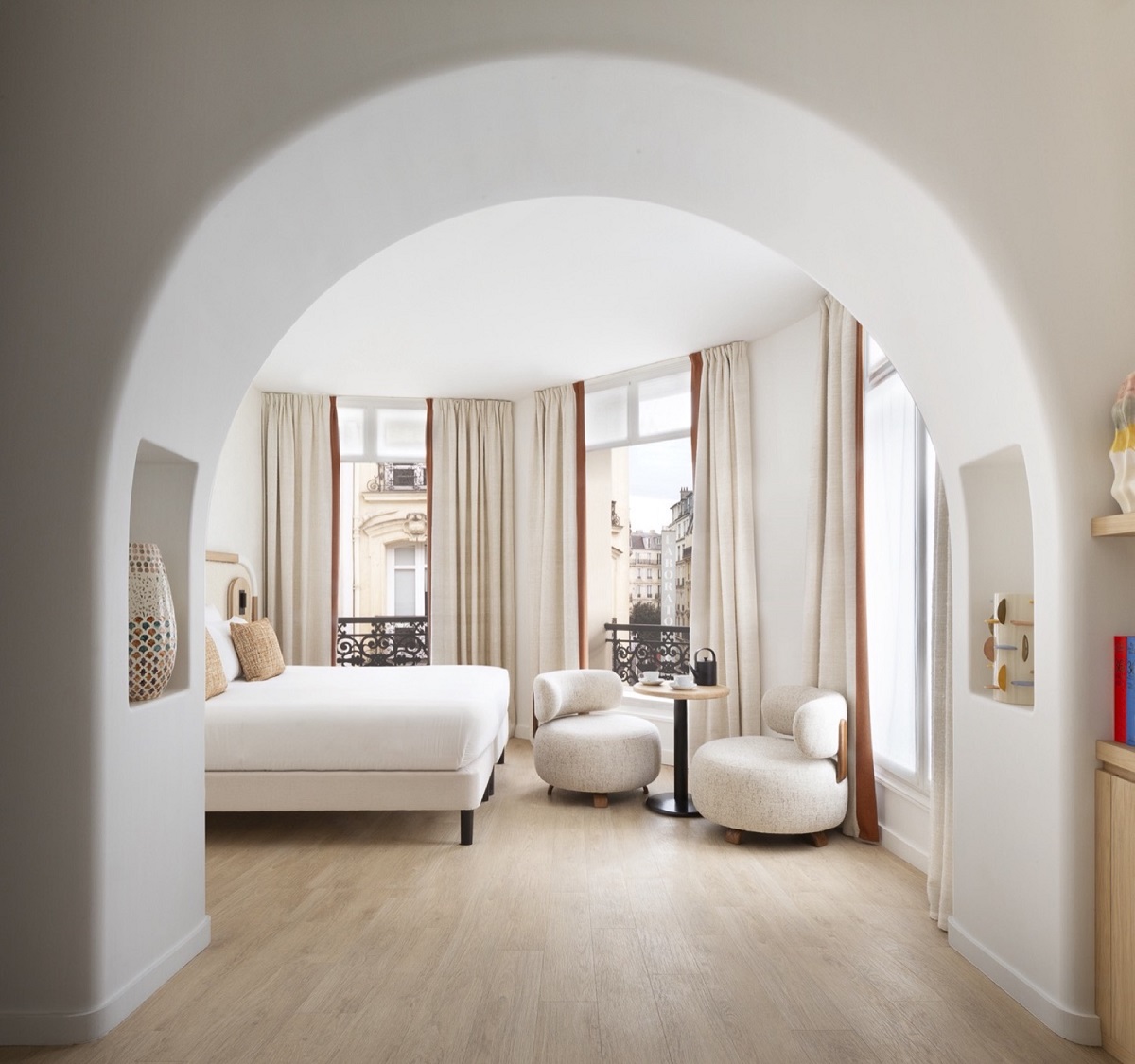 cream white and wood guestroom in Hotel Drouot