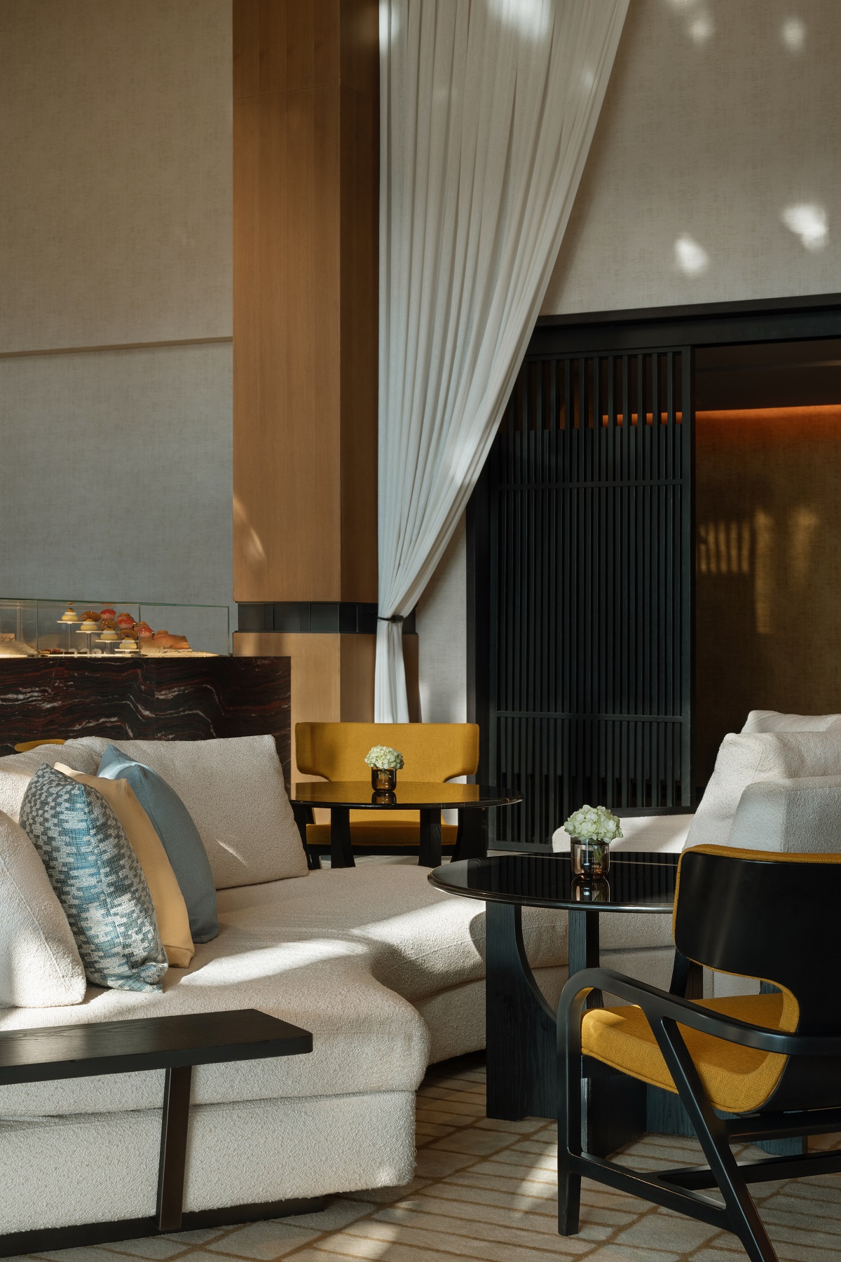 white draped curtain with sofa and sunlight in the Banyan Tree dubai