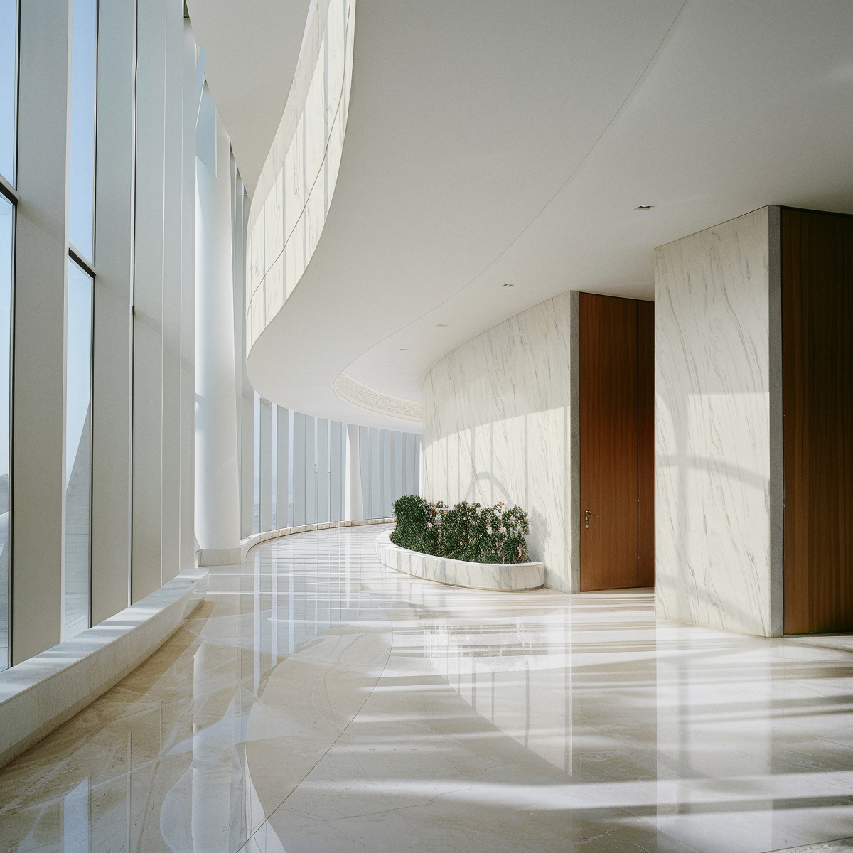 white on white sweeping entrance with Corian surfaces