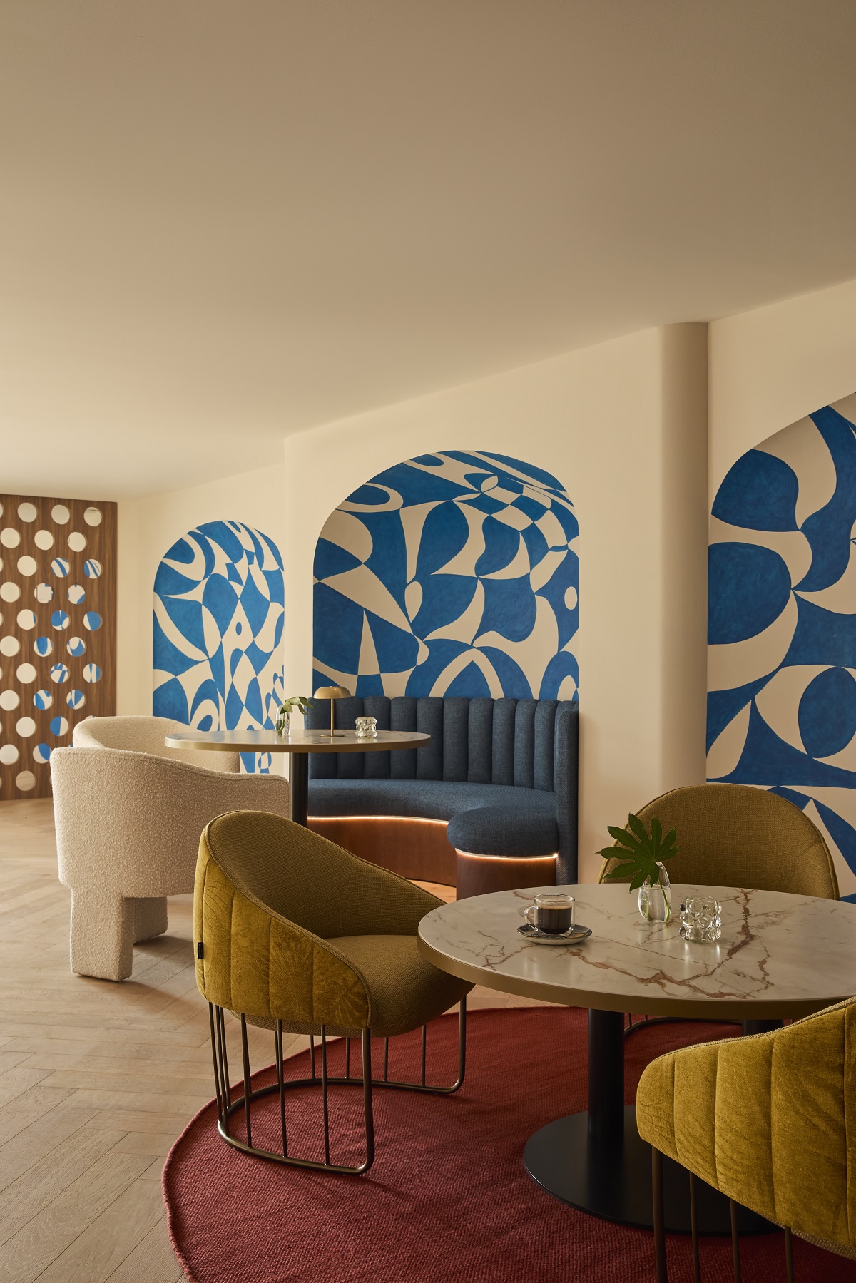 curved niches in bar area with abstract blue murals