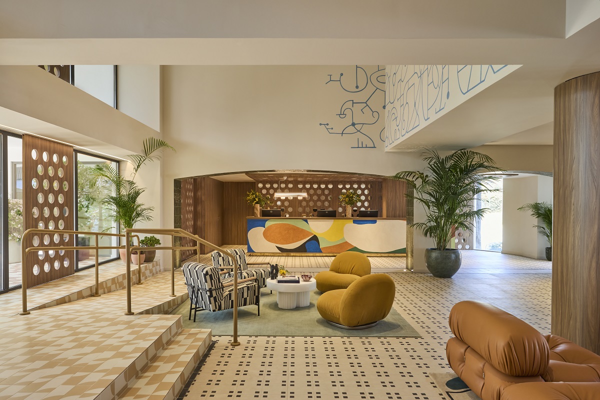 lobby with light filtering screen and abstract murals