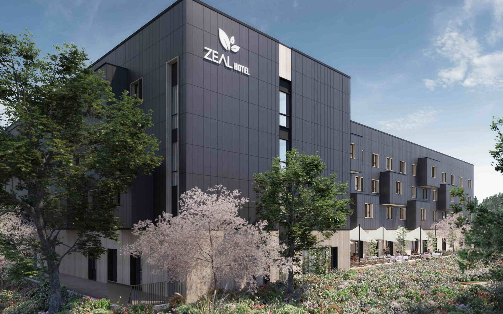 Exterior of Voco Zeal hotel in exeter. Charcoal coloured outer with image taken against dusk sky