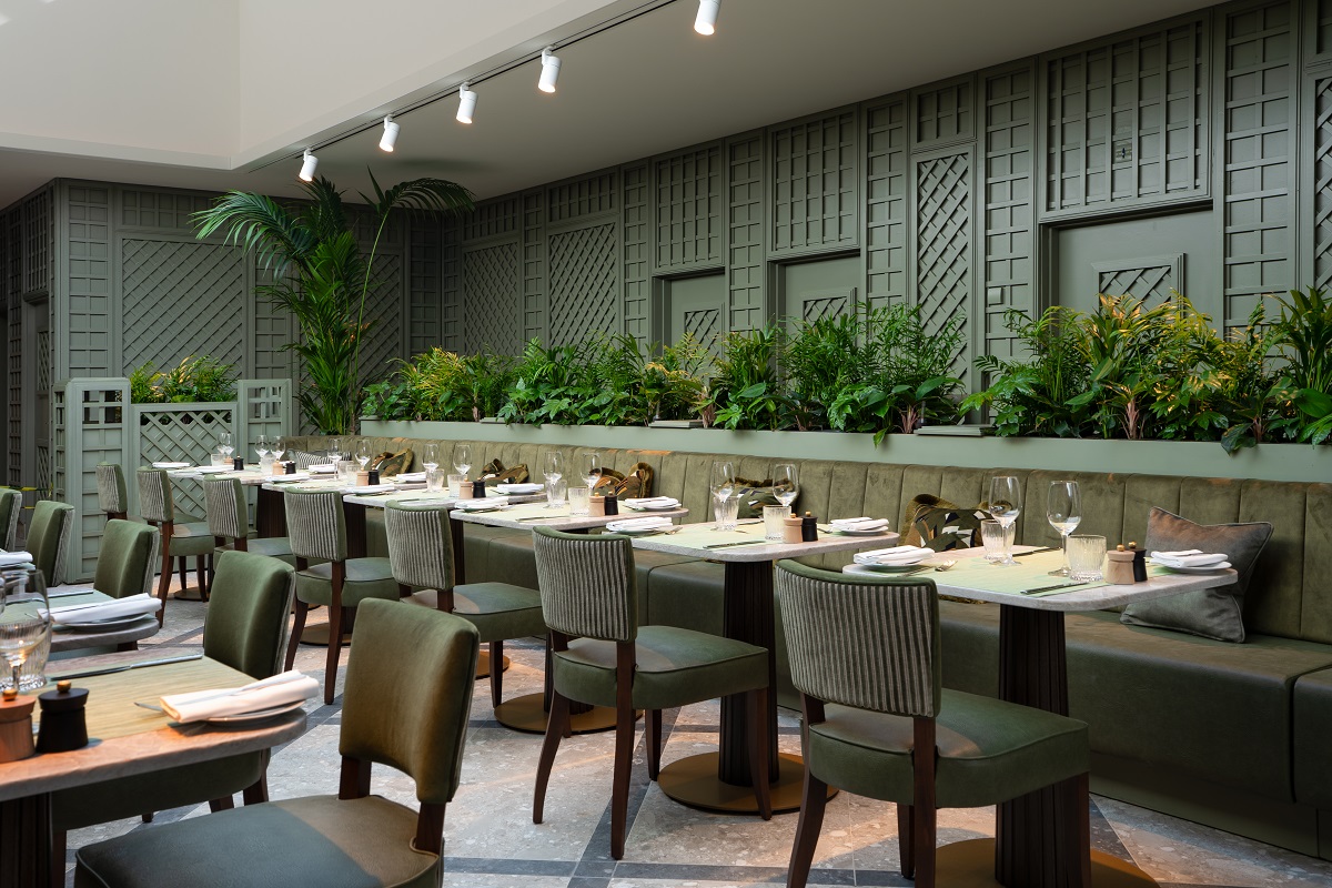 sage green walls and furniture and green planiting in Foverans Resturant in Crossbasket Castle