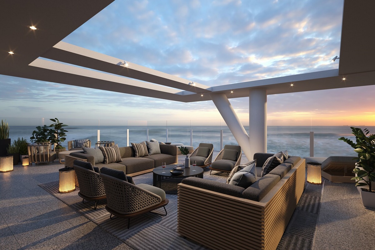 floor lamps and seating on the outdoor terrace with ocean views