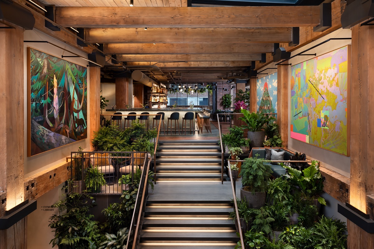 stair leading into Populus hotel flanked with plants and art