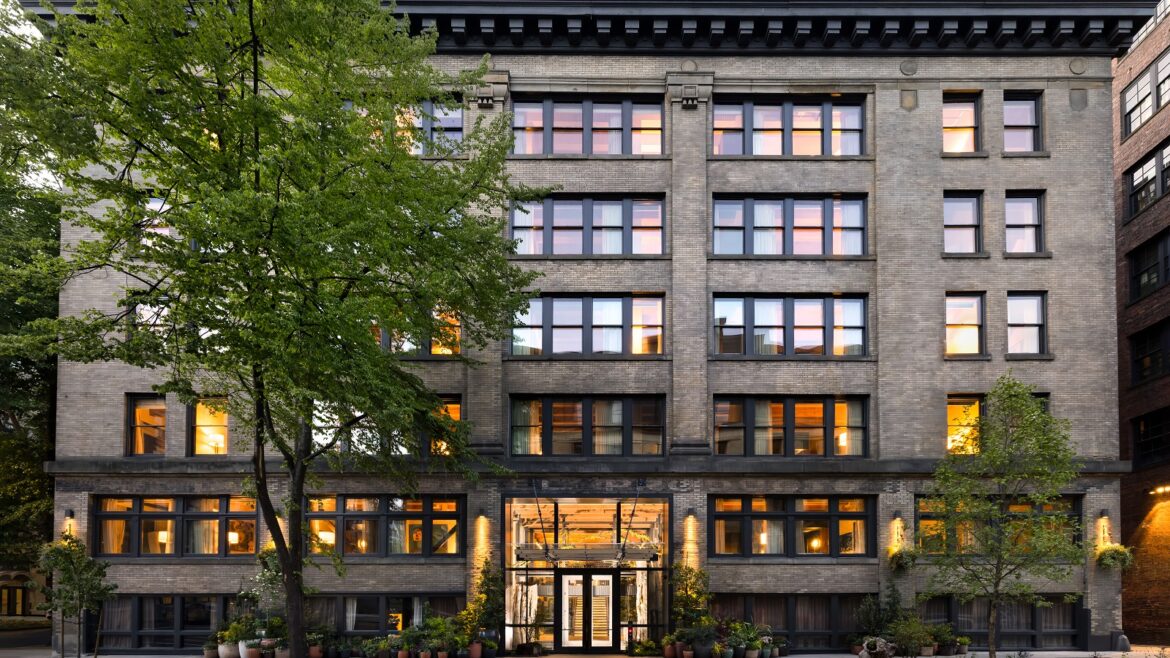 exterior facade of Populus Seattle, a carbon positive hotel in Seattle’s historic Pioneer Square