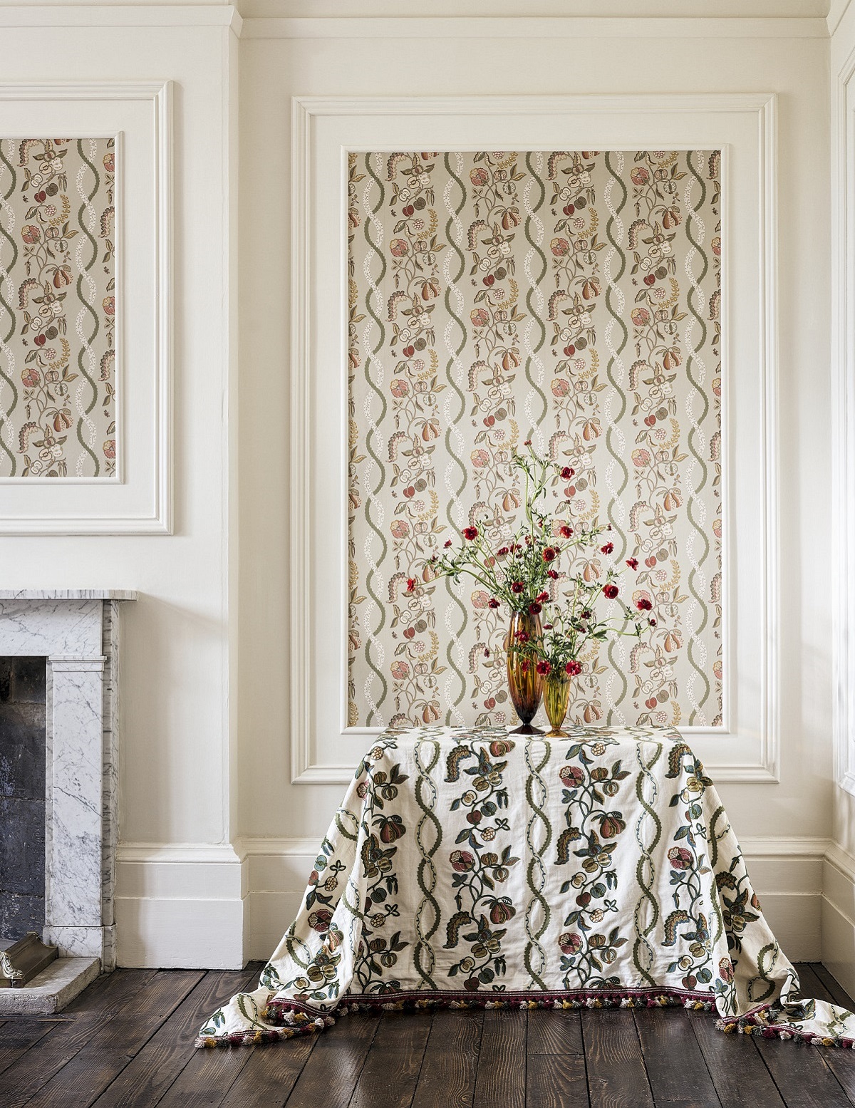 room set with table, flowers and floral wallpaper on panel