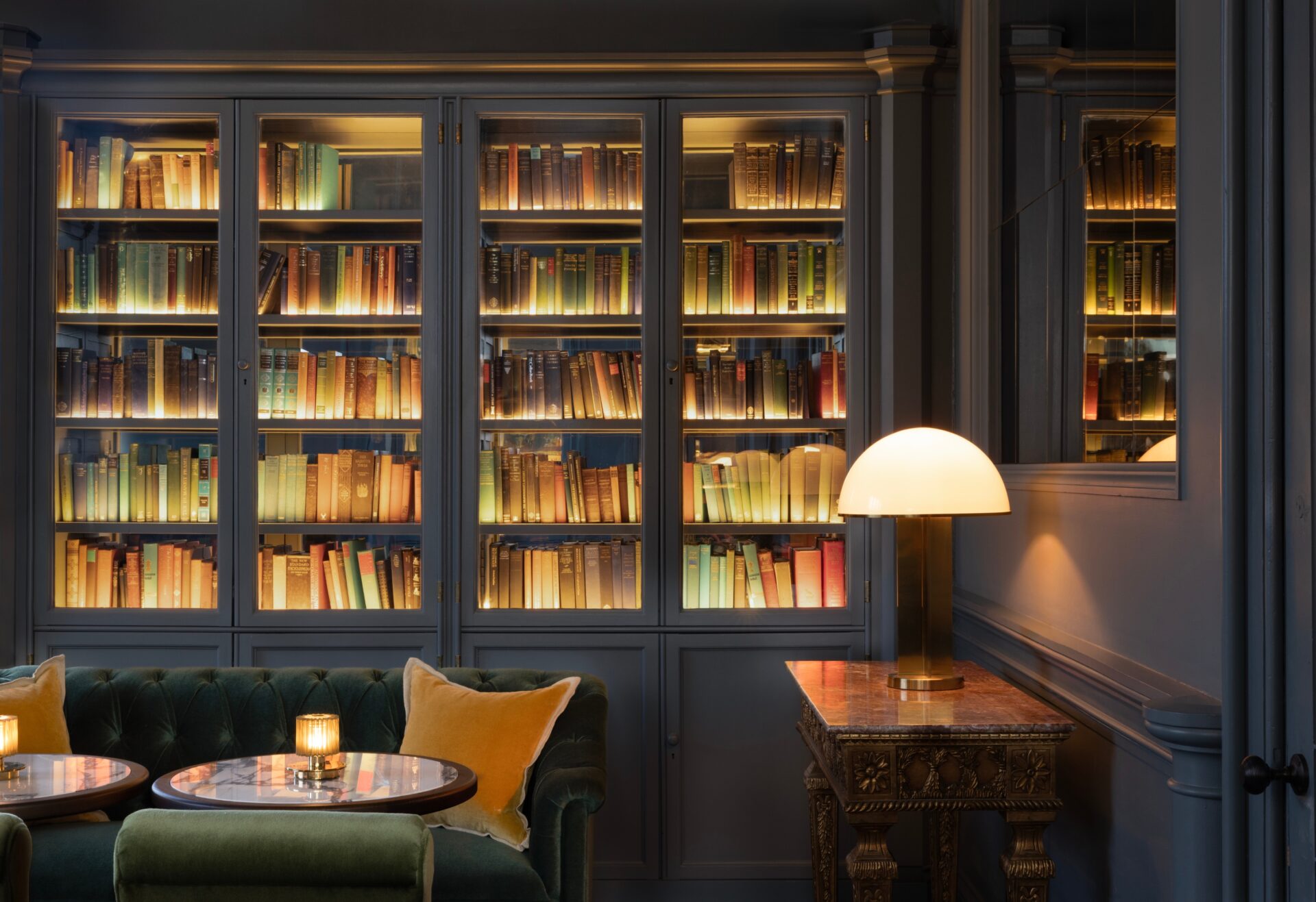 seating and library shelves with books in the hotel library