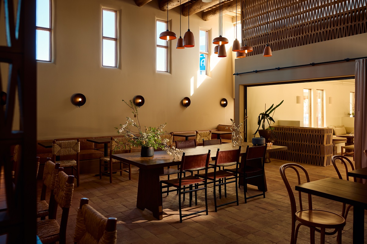 central wooden dining table in Hotel Willa