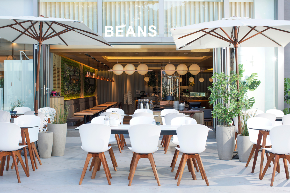 BoConcept Trade & Contract Beans restaurant project in Hong Kong. White dining chairs with natural wood legs