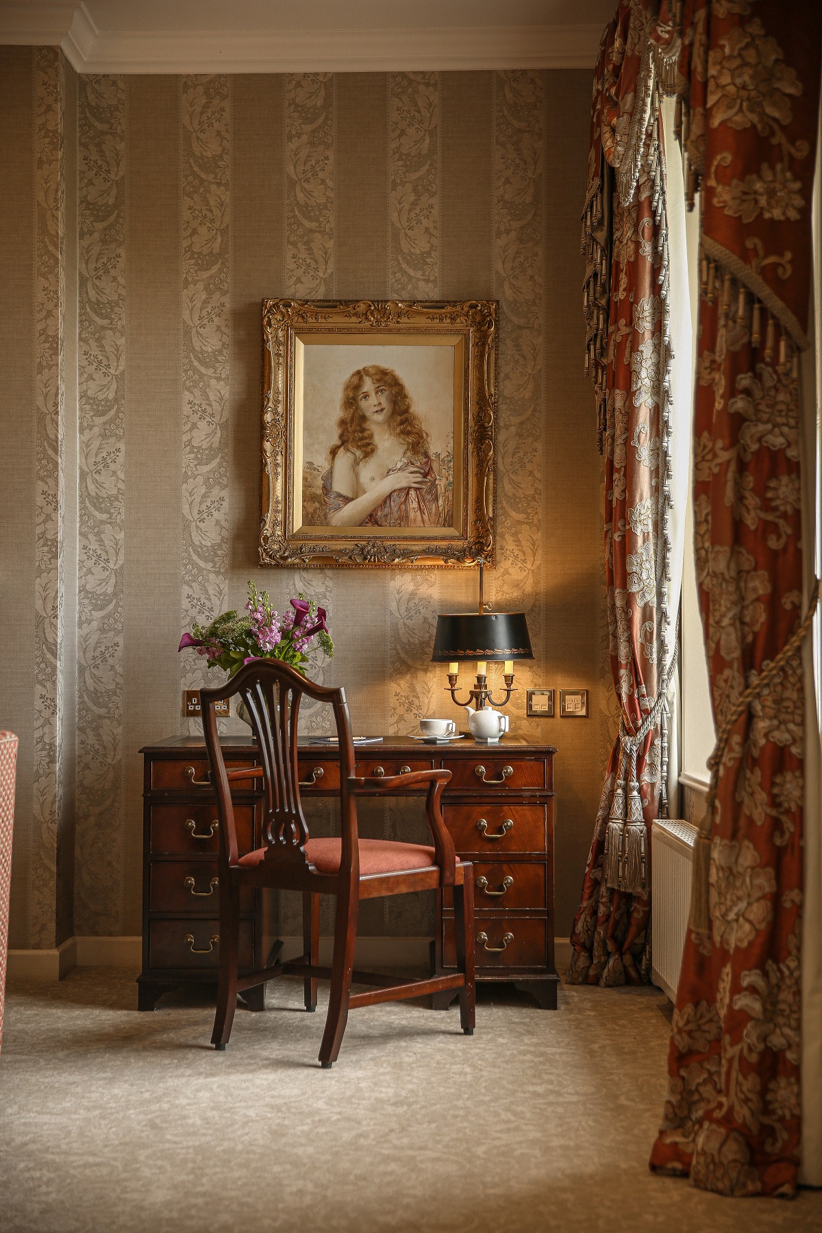 antique desk and chair with portrait