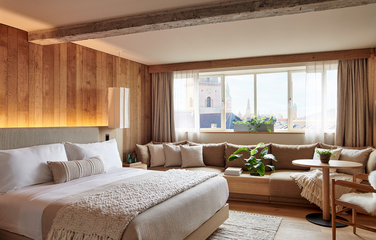bed and seating in 1 Hotel Copenhagen guest suite