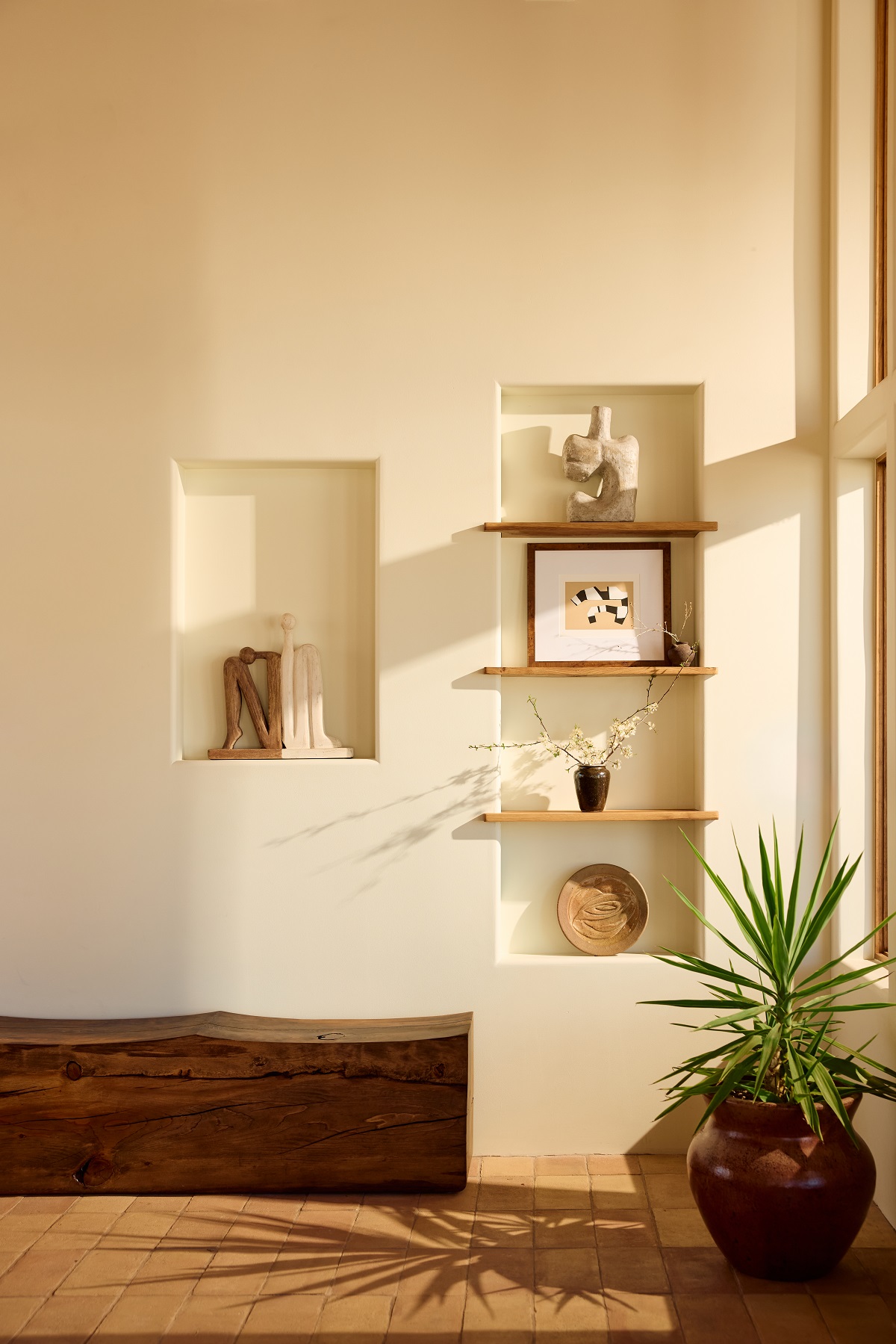 wall niches in plaster in Hotel Willa with ceramics and art on display