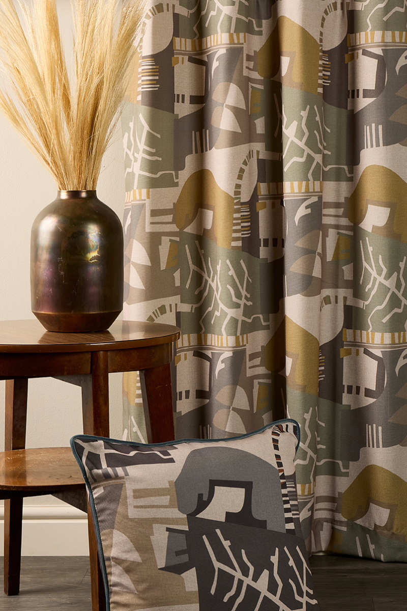 Latitude fabric by Skopos with striped wall behind