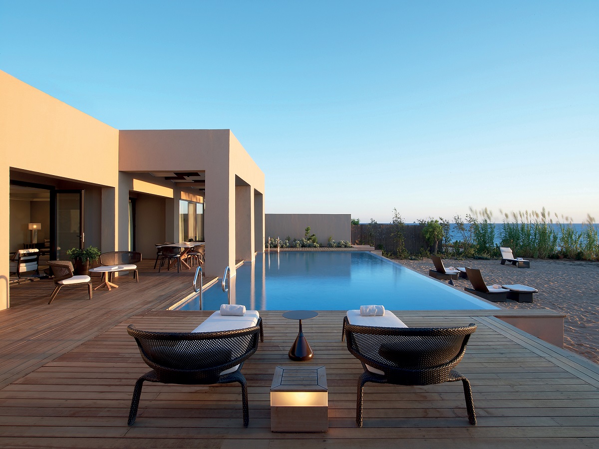 blue tiled pool sunken into wooden terrace