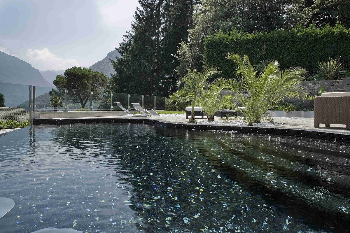 black swimming pool with black mosaic tiles