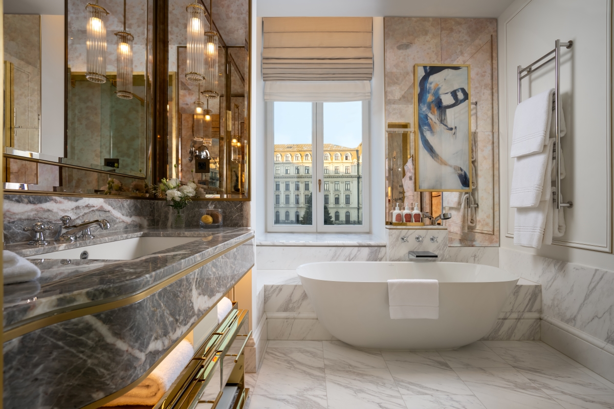 Marble clad bathroom with hints of blue and gold at Corinthia Bucharest