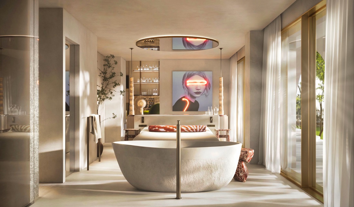 freestanding bath in guestroom at end of the bed