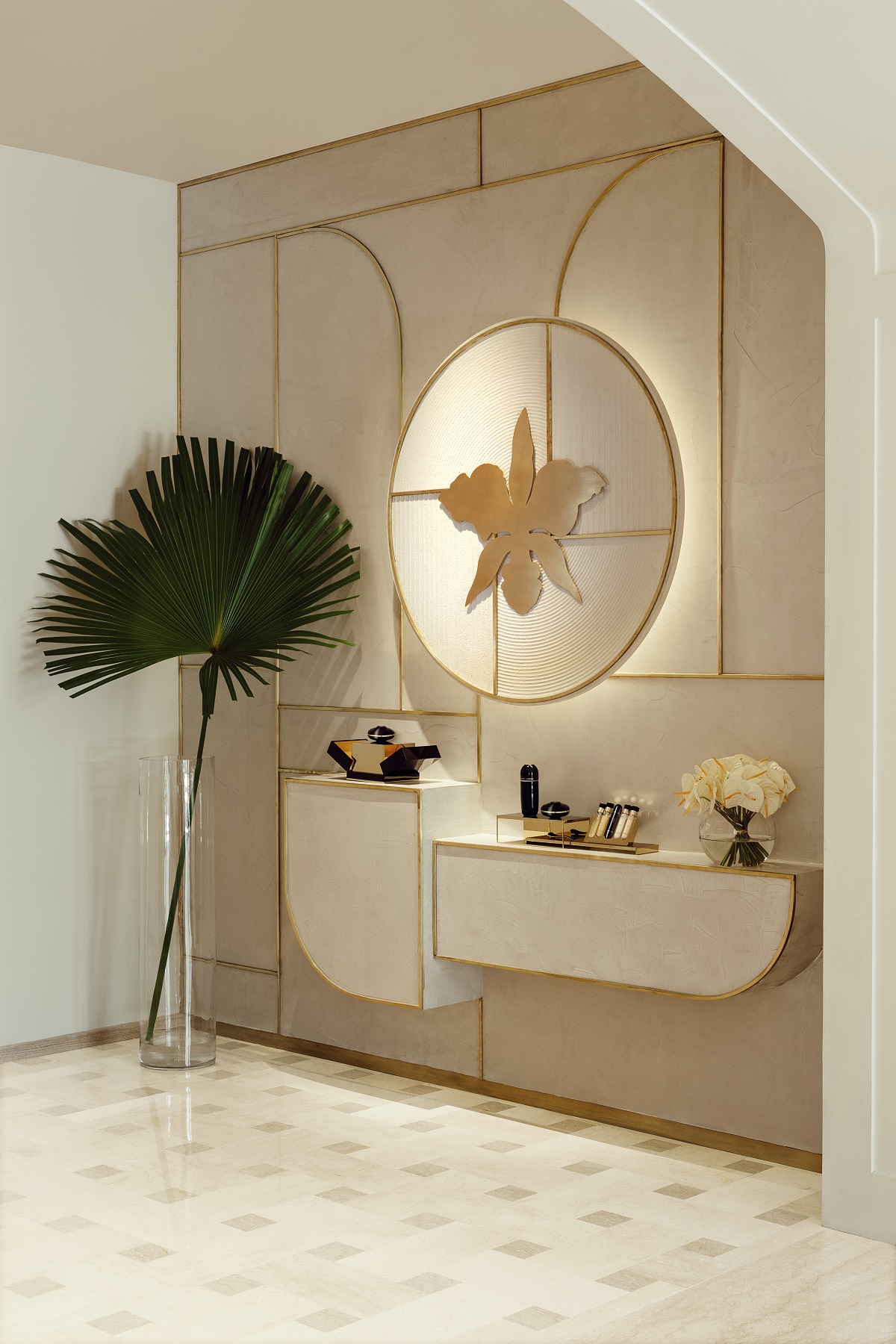 spa design detail with round mirror and palm leaf