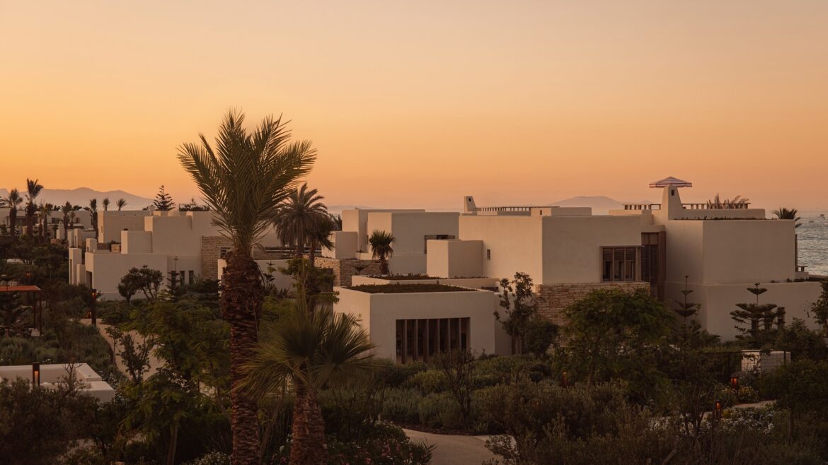 sunset and palm trees over Royal Mansour Tamuda Bay