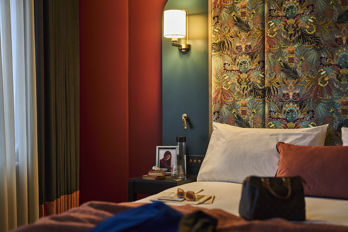 bold wallpaper and dark colours in the Other House bedroom