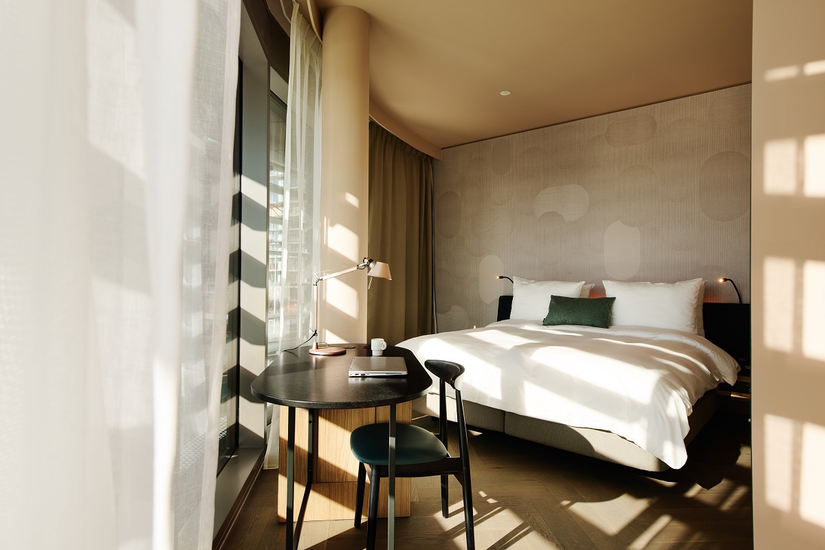 light through sheer curtains in hotel guestroom